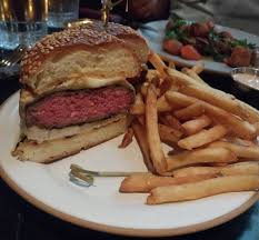 Lowland Tavern signature dishes Tavern Burger, Pan Roasted Fish, Crispy Fried Chicken Sandwich, Smoked Fish Dip